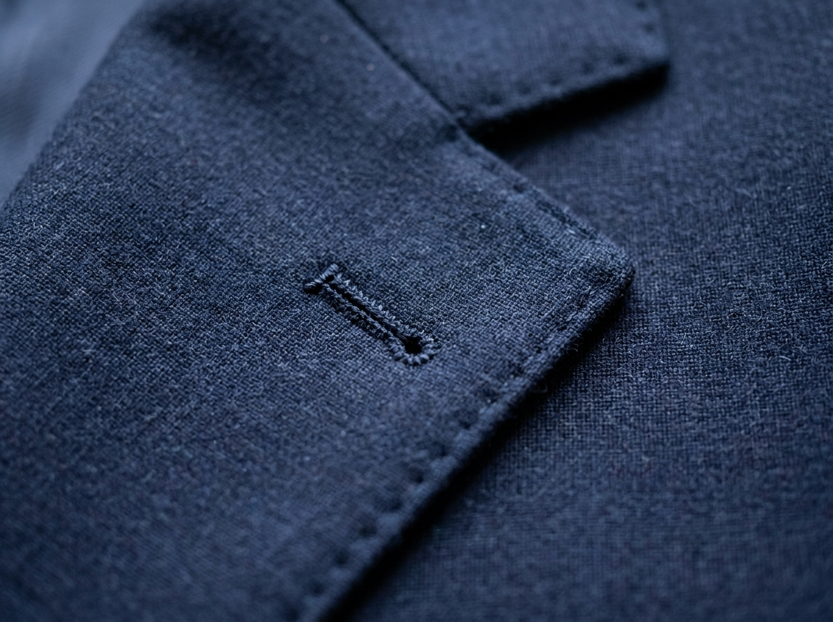 Close-up of a high-quality, professional navy blue dress shirt.